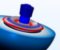 A tonpilz transducer model in red, white, and blue.