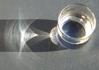 A glass of water generating caustics.