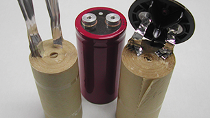 Three aluminum electrolytic capacitors.