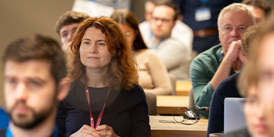 Six COMSOL Conference attendees partake in a discussion during a minicourse.