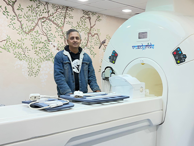 A doctor performing physical testing with an MRI machine.