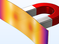 A close-up view of a permanent magnet model showing the deformation in an iron plate.