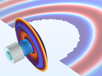 A close-up view of a tonpilz transducer showing piezoceramic rings.