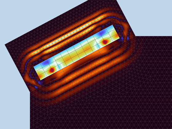 A closeup view of a piezoelectric transducer in an angle beam NDT model showing the electric potential, wave profile, and mesh.