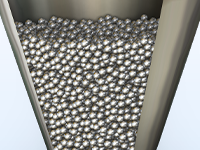Detailansicht eines mit Körnern gefüllten Trichtermodells.