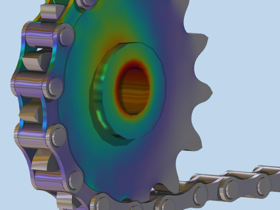 A close-up view of a roller chain sprocket assembly showing the stress.