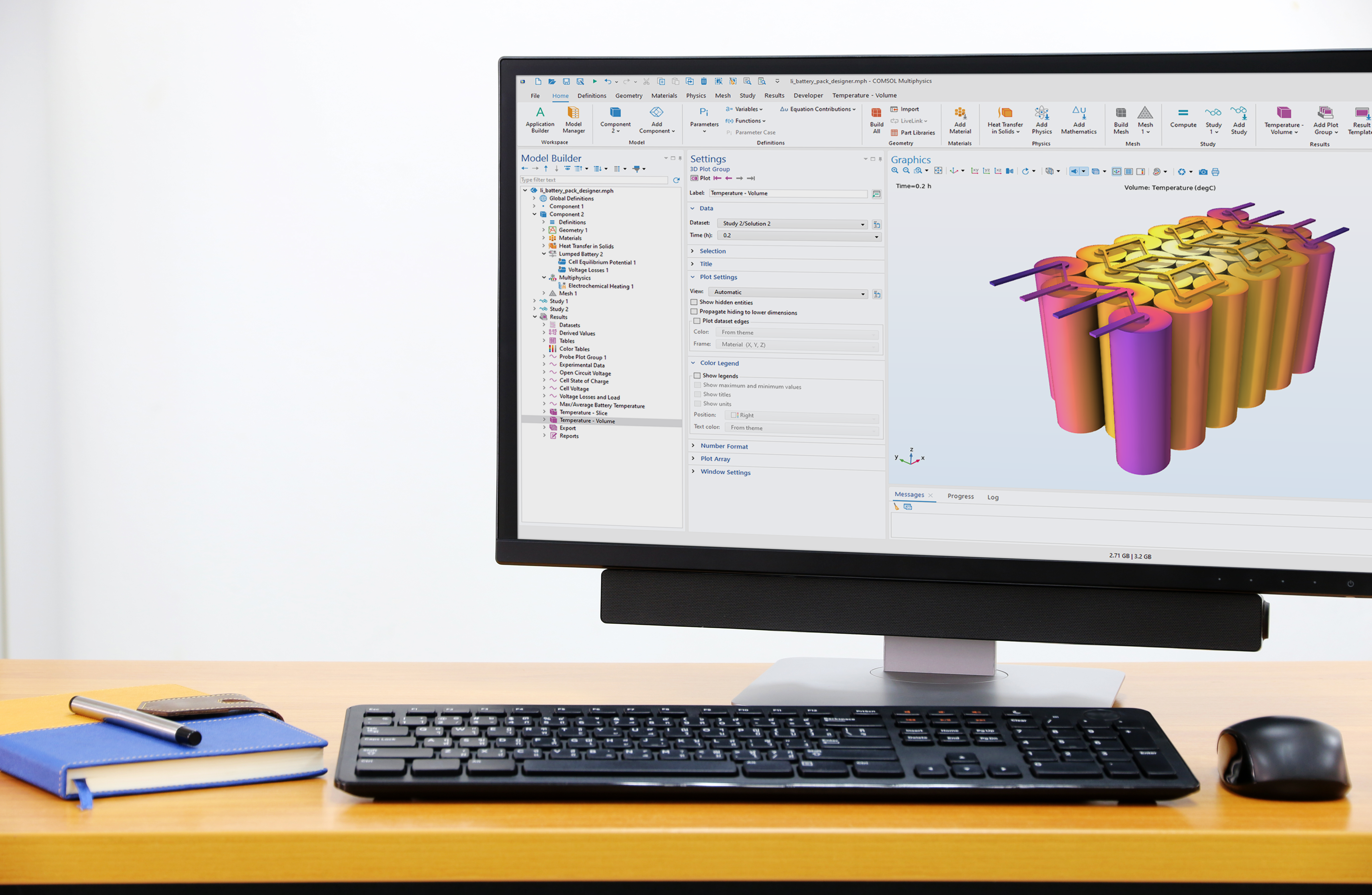 A desktop computer showing the COMSOL Multiphysics UI with a battery pack model in the Graphics window.