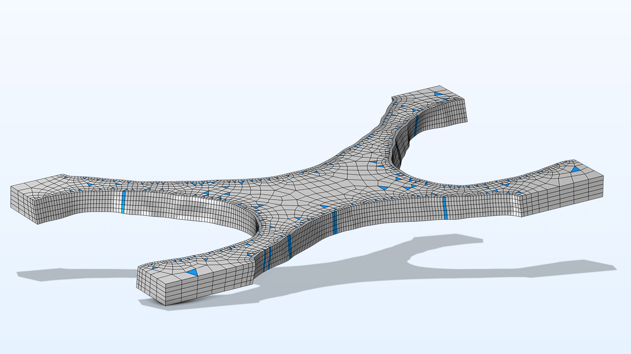 A grey 3D model with the prism shaped elements colored in blue.