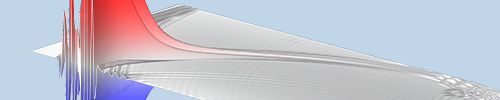A rectangular model in gray with ripples and large spikes in red and blue.