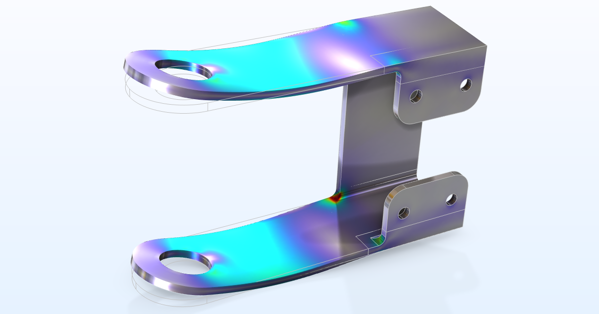 The bracket model displaying a metallic appearance with parts of the structure showing a color range from white to red for the Von Mises stress.