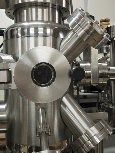 A photograph of a vacuum chamber made out of stainless steel.