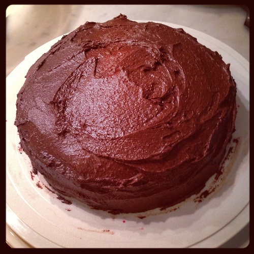 Round egg-less vegan chocolate cake.