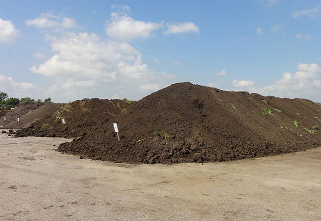 A photo of a commercial compost pile.