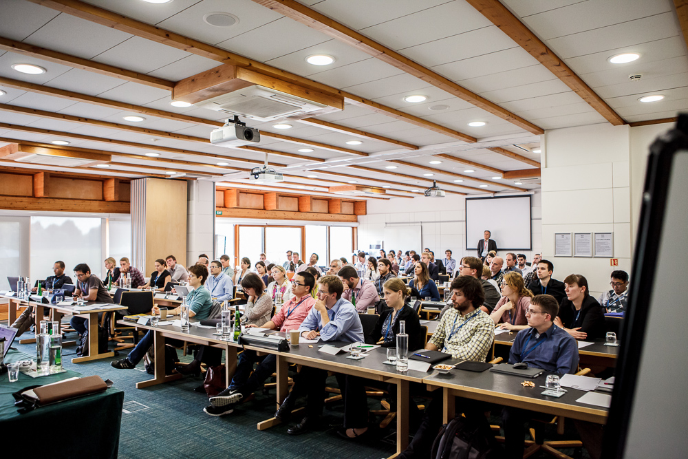 A photo of COMSOL Conference 2014 attendees learning from a presentation.