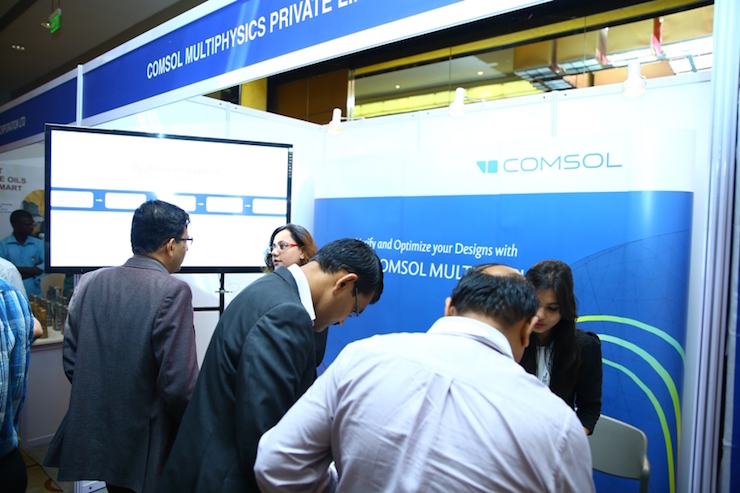 A photograph of COMSOL employees at an automotive R&D conference.