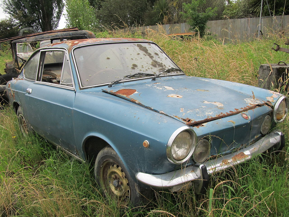 A photograph of a car dealing with the effects of corrosion.