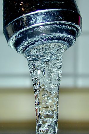 Water from a faucet.