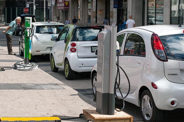 A photograph of a line of electric vehicles, which use permanent magnet motors to operate.