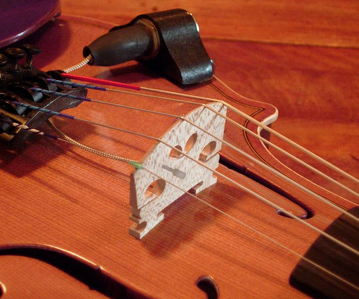 Photograph of a piezoelectric violin bridge.