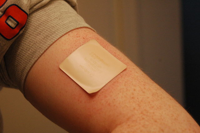 Photograph displaying a transdermal drug delivery patch.