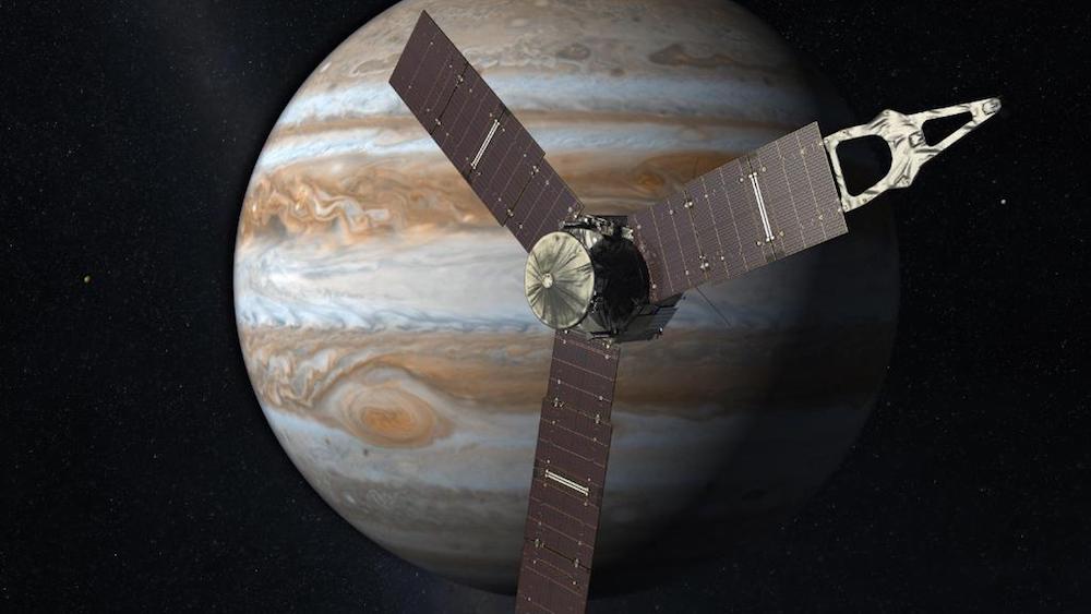 A photograph of the Juno spacecraft nearing Jupiter.