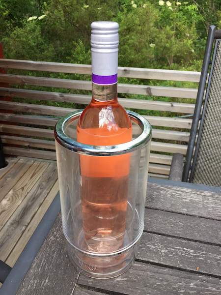 A photo of a rosé bottle inside a wine cooler.