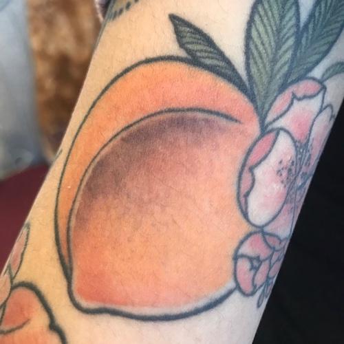 A tattoo of a peach.