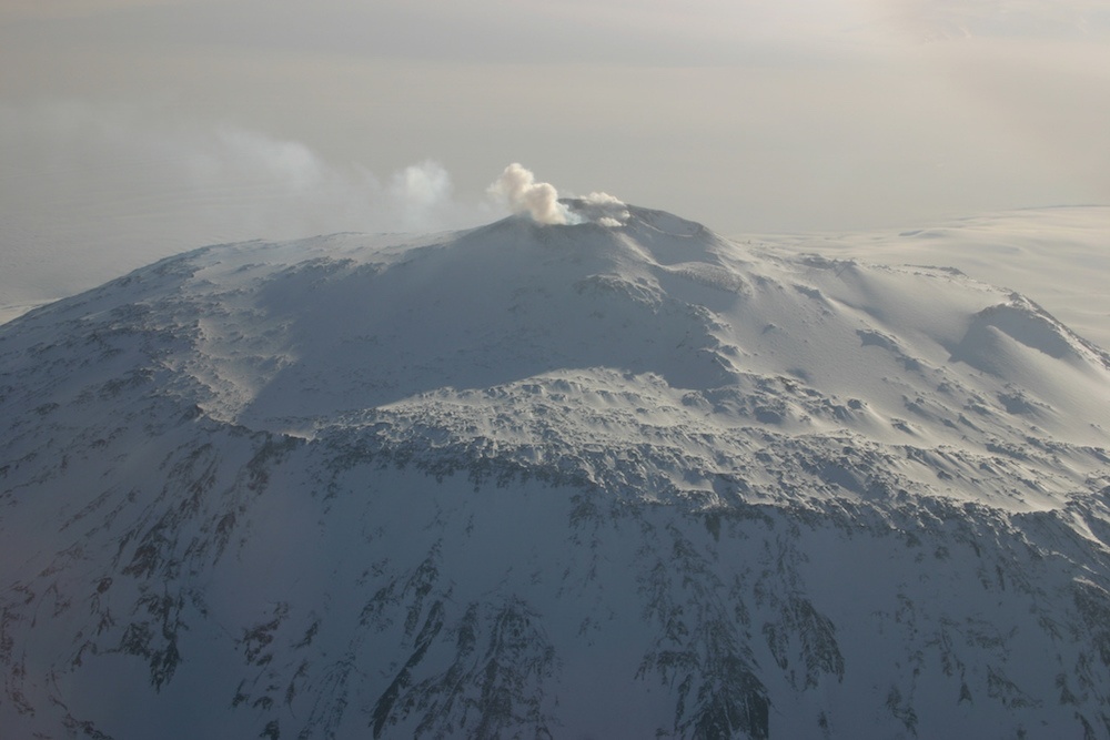 A photograph of Mount Erebus, an active volcano in Antarctica.