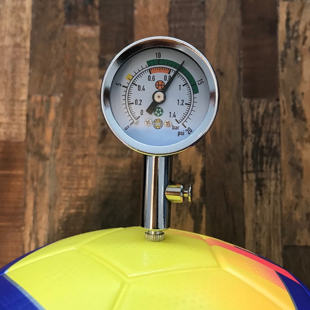 A close-up photo showing the pressure of the Nike Ordem V ball used in the soccer ball experiment.