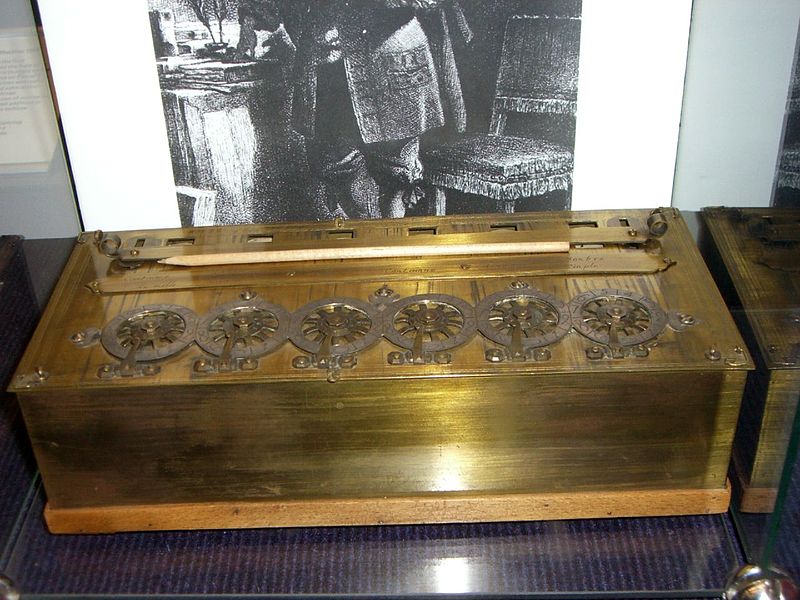 A photograph of a Pascaline, an early calculator device.