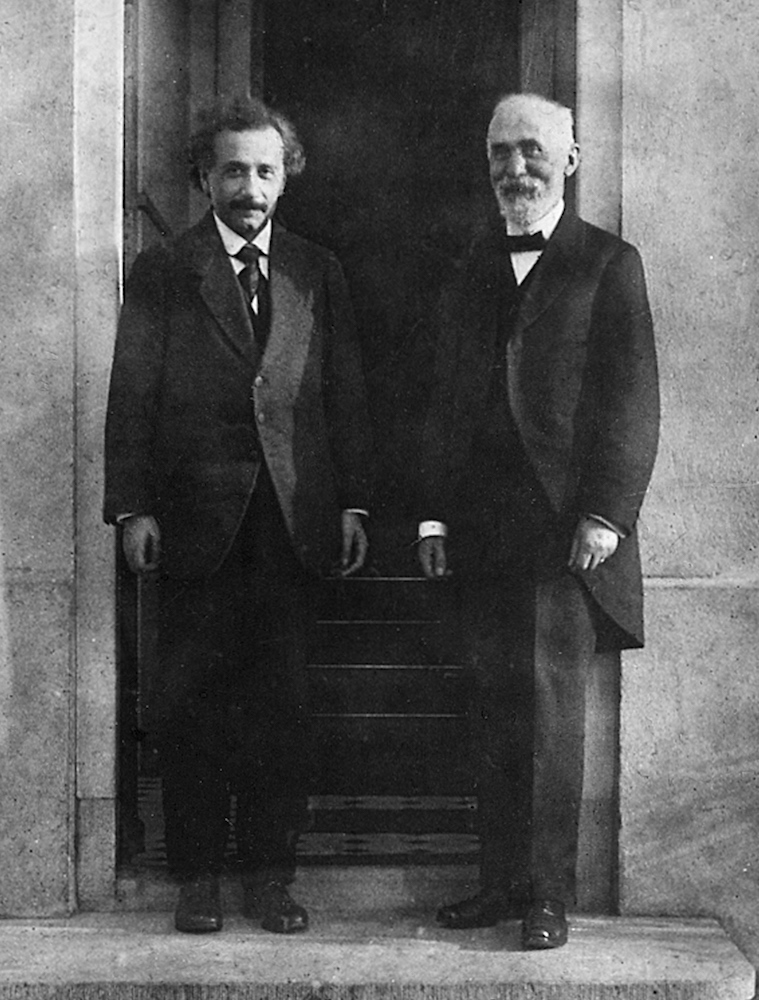 A black-and-white photo of Albert Einstein and Hendrik Lorentz.