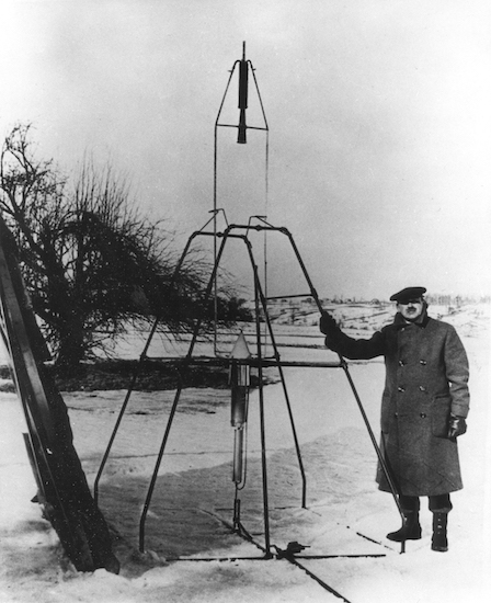 A photograph of Robert Hutchings Goddard standing at the site of his first rocket launch.