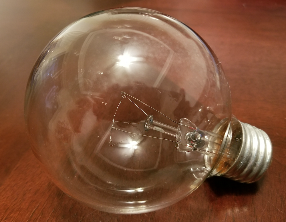 A photograph of an incandescent light bulb.