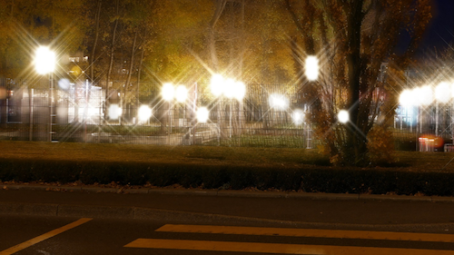 A photograph showing how people with presbyopia see a glare in their vision at night.