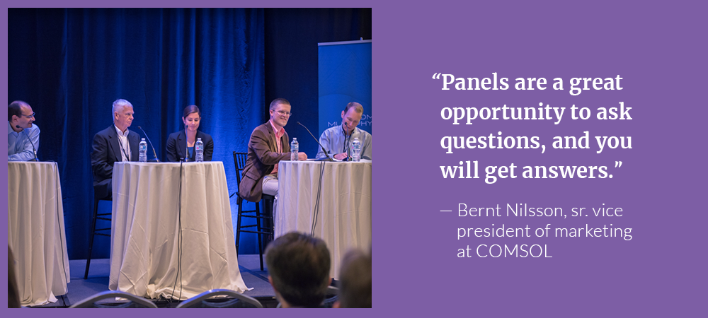 A photograph from a panel discussion on simulating batteries and fuel cells.