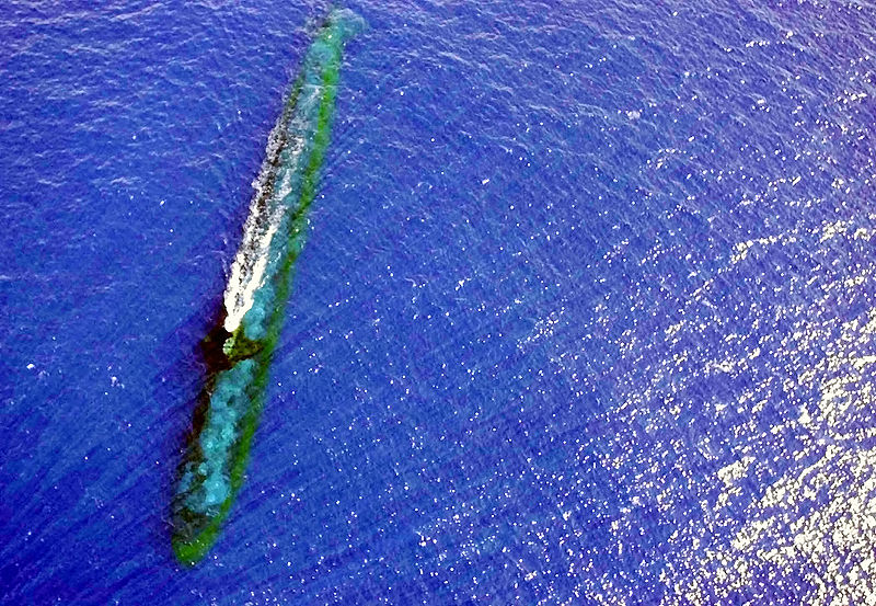 A photograph of a submarine that is underwater.