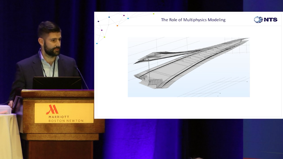 A photograph of Justin McKennon presenting on lightning protection systems at the COMSOL Conference 2018 Boston.