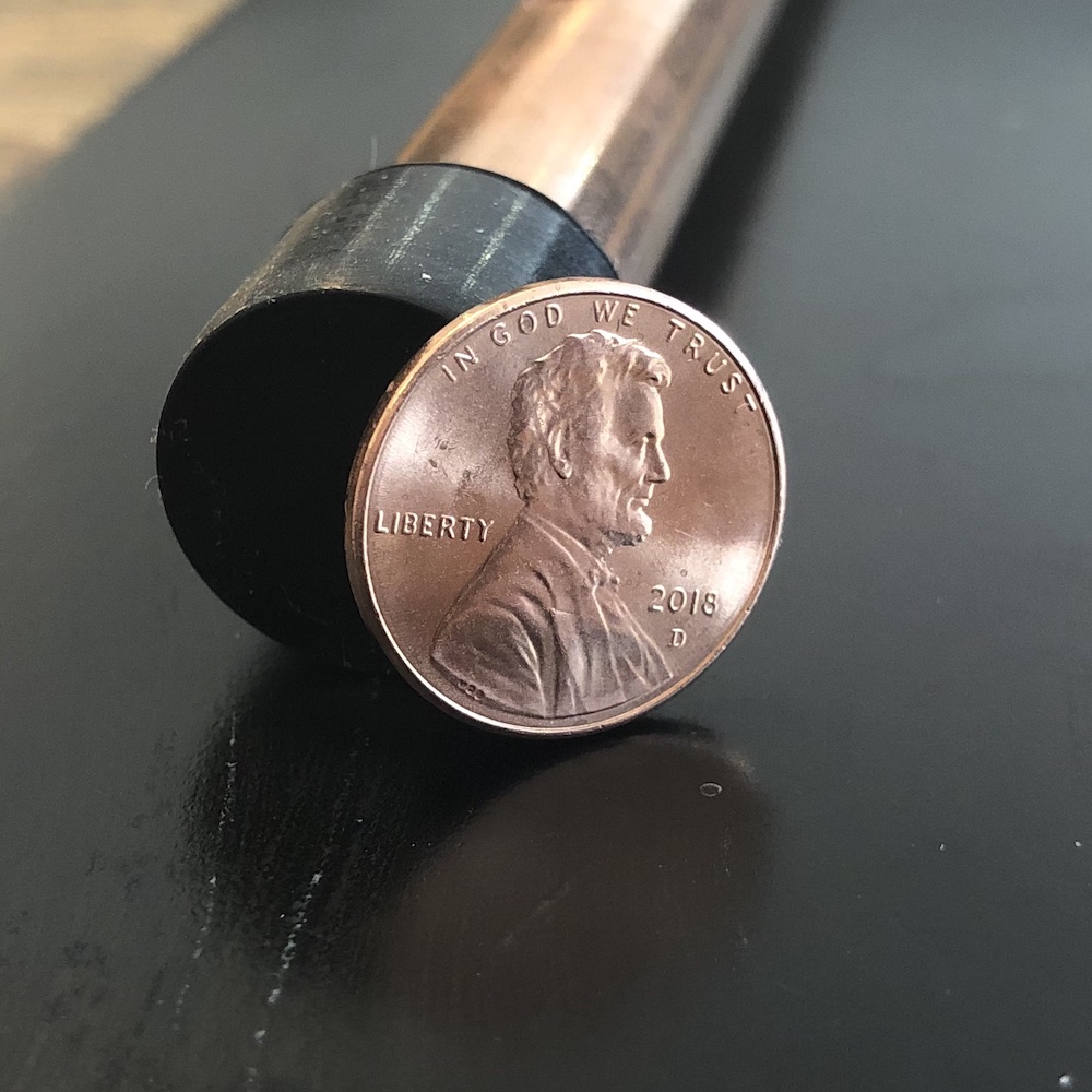 A photograph of a copper penny.