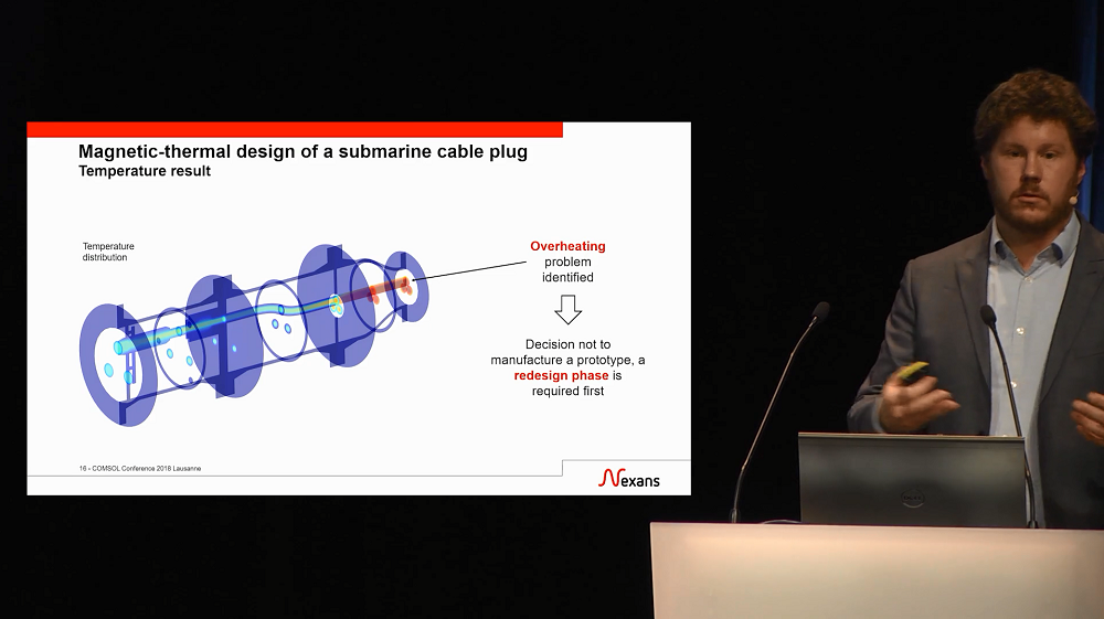 A photograph of Adrien Charmetant giving a keynote talk about designing cable systems.