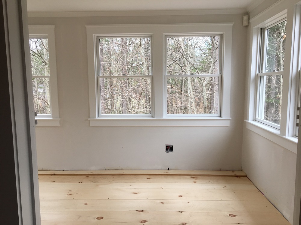 A photograph of window glass and framing in a newly constructed home.