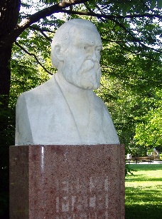 A photograph of a bust of Ernst Mach on display in Vienna.