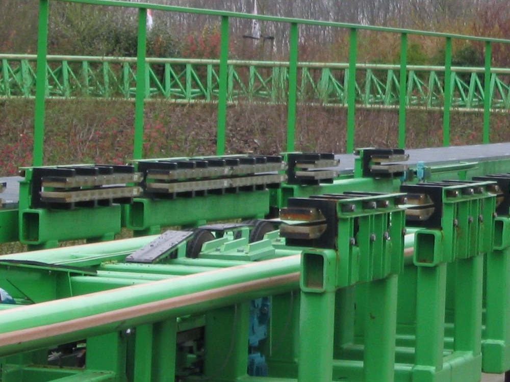A photo of the brakes on a rollercoaster track.