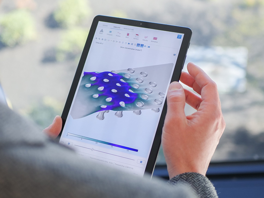 A photograph of a simulation application accessed from a tablet using COMSOL Client for Android™.