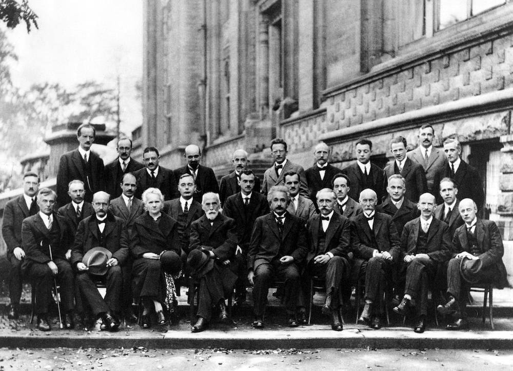 A photograph of notable attendees at the Solvay Conference in 1927, including Max Planck.