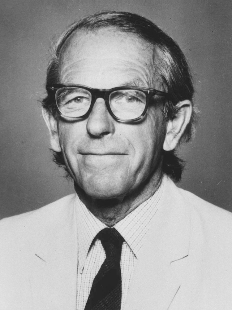 A photograph of biochemist Frederick Sanger.