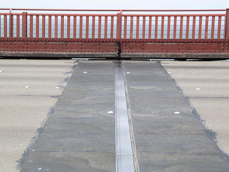 A photograph of an expansion joint on the Golden Gate Bridge, these joints gives bridges room to expand in cases of thermal expansion.