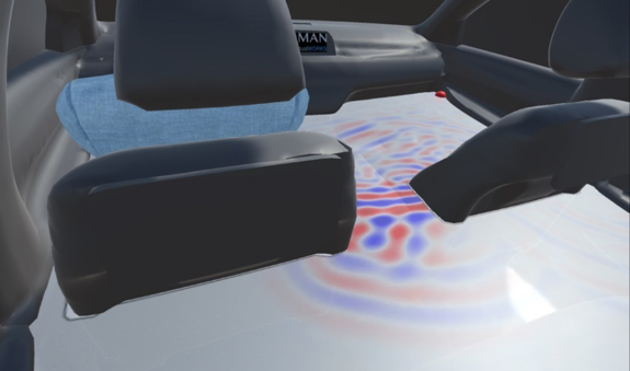 A virtual rendering of a the back seat of a car with the acoustic sound field shown in red, blue, and white.