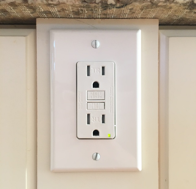 A photograph of a standard US electrical outlet.