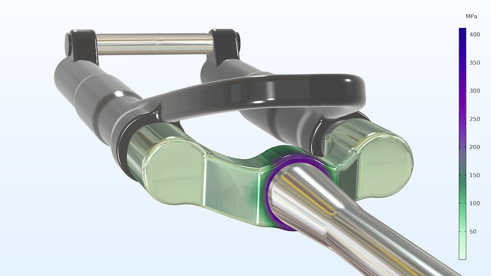 An image of a mountain bike fork modeled in COMSOL Multiphysics version 5.6 to show the stress distribution.