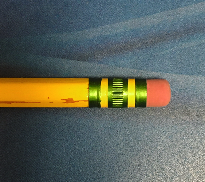 A photograph of the end of a typical yellow pencil, with a pink rubber eraser.